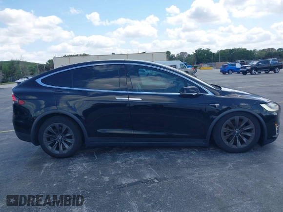 2017 Tesla Model X 90D with VIN 5YJXCBE21HF054898, listed as a IAAI auction lot 42076462 with 89,996 mi miles and . Bid and sale history available at DreamBid. Image 12.