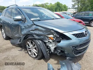 2012 Mazda CX-9 Grand Touring z VIN JM3TB2DA1C0334863, wystawiony jako IAAI lot #42157222 z przebiegiem 277 786 mil mil oraz . Historia ofert i sprzedaży dostępna na DreamBid. Obrazek 1.
