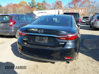 2018 Mazda 6 Grand Touring with VIN JM1GL1TY0J1319083, listed as a IAAI auction lot 40852818 with 57,408 mi miles and . Bid and sale history available at DreamBid. Image 16.