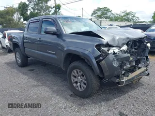 2018 Toyota Tacoma SR with VIN 3TMCZ5AN2JM176623, listed as a IAAI auction lot 42348677 with 84,064 mi miles and . Bid and sale history available at DreamBid. Image 1.