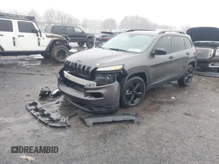 2016 Jeep Cherokee Sport with VIN 1C4PJMAB8GW318412, listed as a IAAI auction lot 41547774 with 150,078 mi miles. Bid and sale history available at carsss.com. Image 2.