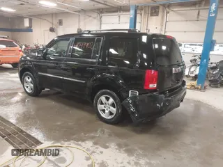 2012 Honda Pilot Touring with VIN 5FNYF4H91CB067014, listed as a IAAI auction lot 41749402 with 151,248 mi miles. Bid and sale history available at carsss.com. Image 3.