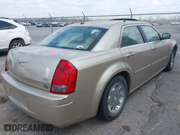 2006 Chrysler 300 Touring with VIN 2C3KA53G56H309497, listed as a IAAI auction lot 41792324 with 128,492 mi miles. Bid and sale history available at carsss.com. Image 4.