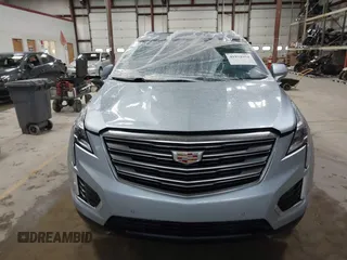 2017 Cadillac XT5 Premium Luxury AWD z VIN 1GYKNERS4HZ306955, wystawiony jako IAAI lot #41932934 z przebiegiem 150 050 mil mil oraz . Historia ofert i sprzedaży dostępna na DreamBid. Obrazek 12.