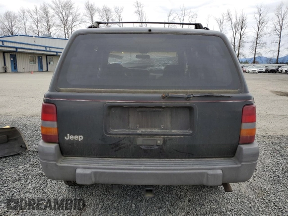 1996 Jeep Grand Cherokee Laredo with VIN 1J4GZ58S2TC174270, listed as a Copart auction lot 49924815 with 0 mi miles and Salvage Title. Bid and sale history available at carsss.com. Image 6.
