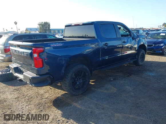 2023 Chevrolet Silverado 1500 LT Trail Boss with VIN 3GCUDFE8XPG152588, listed as a IAAI auction lot 41824795 with 21,903 mi miles and . Bid and sale history available at DreamBid. Image 4.