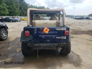 2000 Jeep Wrangler Sport with VIN 1J4FA49S0YP770943, listed as a Copart auction lot 68615524 with 165,377 mi miles and Salvage Title. Bid and sale history available at carsss.com. Image 6.