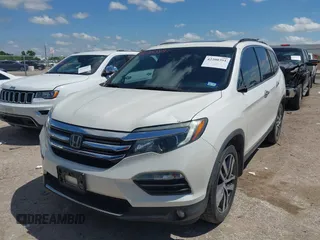 2017 Honda Pilot Touring with VIN 5FNYF6H92HB054145, listed as a IAAI auction lot 42200391 with 70,096 mi miles and . Bid and sale history available at DreamBid. Image 20.