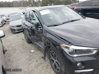 2018 BMW X1 xDrive28i with VIN WBXHT3C34J5K21576, listed as a IAAI auction lot 41822390 with 69,645 mi miles. Bid and sale history available at carsss.com. Image 6.
