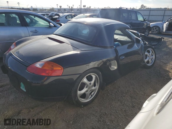 2000 Porsche Boxster z VIN WP0CA2984YU627674, wystawiony jako Copart lot #86027054 z przebiegiem 112 153 mil mil oraz Szkoda całkowita • Salvage title. Historia ofert i sprzedaży dostępna na DreamBid. Obrazek 3.