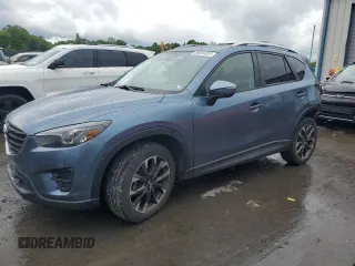 2016 Mazda CX-5 Grand Touring z VIN JM3KE4DY0G0727576, wystawiony jako Copart lot #58004325 z przebiegiem 122 485 mil mil oraz Szkoda całkowita • Salvage title. Historia ofert i sprzedaży dostępna na DreamBid. Obrazek 1.