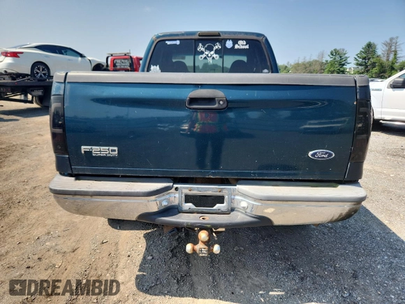 1999 Ford F-250 XL with VIN 1FTNX21FXXEC41173, listed as a Copart auction lot 65117905 with 303,358 mi miles and Clean title. Bid and sale history available at DreamBid. Image 6.