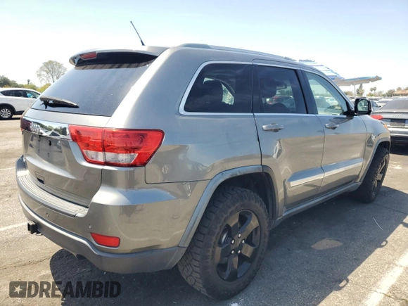 2012 Jeep Grand Cherokee Laredo with VIN 1C4RJEAG0CC104004, listed as a Copart auction lot 53734675 with 150,216 mi miles and Salvage Title. Bid and sale history available at carsss.com. Image 3.