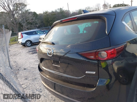 2019 Mazda CX-5 Sport with VIN JM3KFABMXK0693540, listed as a IAAI auction lot 41523569 with 57,895 mi miles and . Bid and sale history available at DreamBid. Image 16.