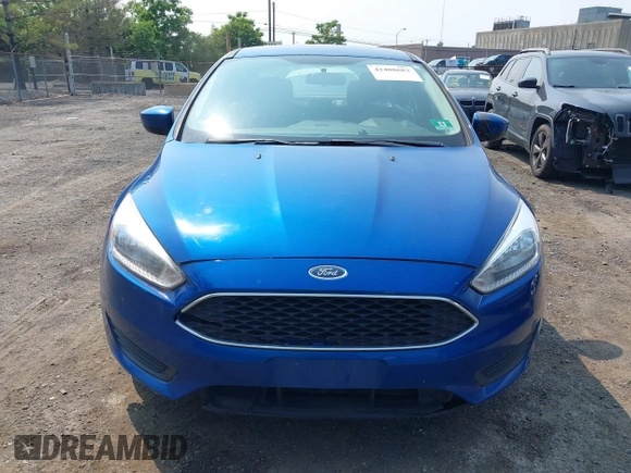 2018 Ford Focus SE z VIN 1FADP3FE1JL254632, wystawiony jako IAAI lot #42408683 z przebiegiem 74 696 mil mil oraz . Historia ofert i sprzedaży dostępna na DreamBid. Obrazek 12.