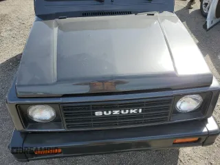 1986 Suzuki Samurai z VIN JS3JC51V8G4110639, wystawiony jako Copart lot #75466894 z przebiegiem Nie podano mil oraz Szkody całkowita. Historia ofert i sprzedaży dostępna na DreamBid. Obrazek 11.
