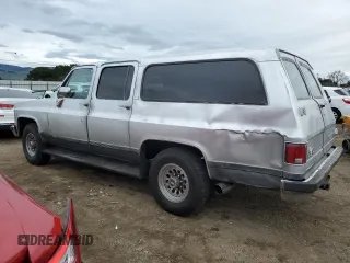 1990 GMC Suburban z VIN 1GKGR26N7LF537148, wystawiony jako Copart lot #45388815 z przebiegiem 265 951 mil mil oraz Tytuł czysty. Historia ofert i sprzedaży dostępna na DreamBid. Obrazek 2.