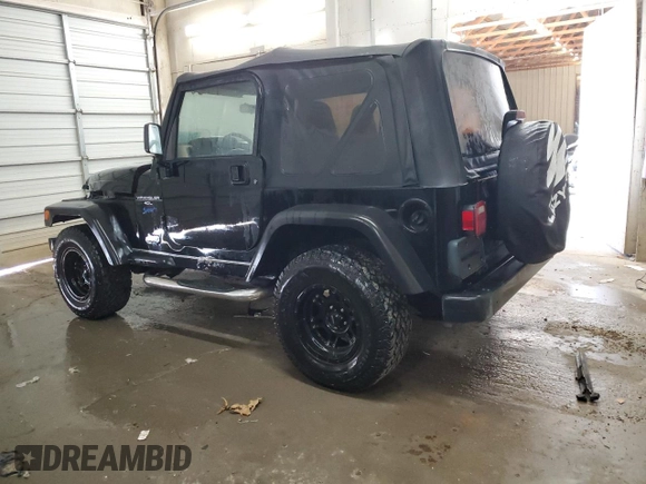 1997 Jeep Wrangler Sport with VIN 1J4FY19S6VP457417, listed as a Copart auction lot 52110535 with 106,129 mi miles and Salvage Title. Bid and sale history available at carsss.com. Image 2.