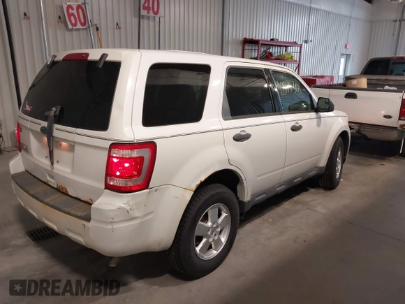 2011 Ford Escape XLS with VIN 1FMCU9C7XBKA40863, listed as a IAAI auction lot 42777301 with 219,848 mi miles and . Bid and sale history available at DreamBid. Image 4.