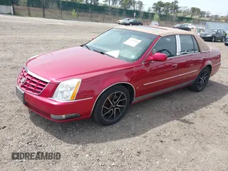 2006 Cadillac DTS w/1SE with VIN 1G6KD57996U113240, listed as a IAAI auction lot 42120004 with 120,806 mi miles. Bid and sale history available at carsss.com. Image 2.