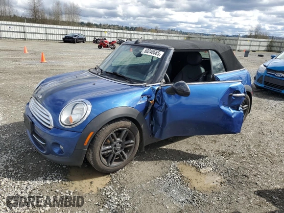 2014 MINI Convertible with VIN WMWZN3C55ET861078, listed as a Copart auction lot 50240665 with 50,541 mi miles and Salvage Title. Bid and sale history available at DreamBid. Image 1.