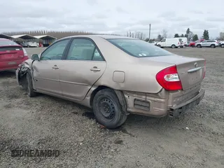 2002 Toyota Camry LE z VIN 4T1BE32K72U028489, wystawiony jako IAAI lot #41760604 z przebiegiem 163 950 mil mil oraz . Historia ofert i sprzedaży dostępna na DreamBid. Obrazek 3.