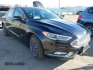 2017 Ford Fusion Energi SE with VIN 3FA6P0PU7HR373391, listed as a IAAI auction lot 41677525 with 99,499 mi miles. Bid and sale history available at carsss.com. Image 1.