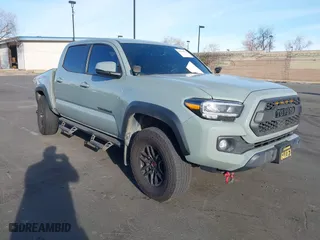 2023 Toyota Tacoma 4WD SR with VIN 3TMCZ5AN4PM574215, listed as a IAAI auction lot 41684524 with 55,855 mi miles. Bid and sale history available at carsss.com. Image 1.
