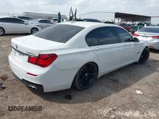 2015 BMW 7 Series 750Li with VIN WBAYE8C54FD780951, listed as a IAAI auction lot 41813038 with 103,131 mi miles. Bid and sale history available at carsss.com. Image 4.