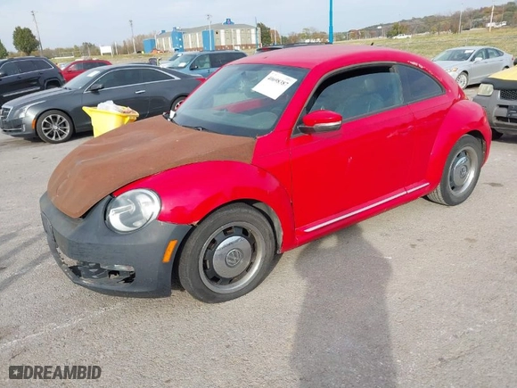 2012 Volkswagen Beetle 2.5L PZEV with VIN 3VWJP7AT0CM641164, listed as a IAAI auction lot 40698387 with 113,200 mi miles. Bid and sale history available at carsss.com. Image 2.