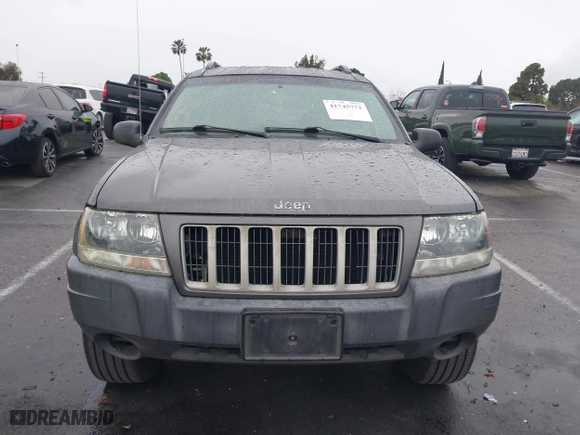 2004 Jeep Grand Cherokee Laredo with VIN 1J4GX48S14C177923, listed as a IAAI auction lot 41745772 with 242,506 mi miles. Bid and sale history available at carsss.com. Image 12.