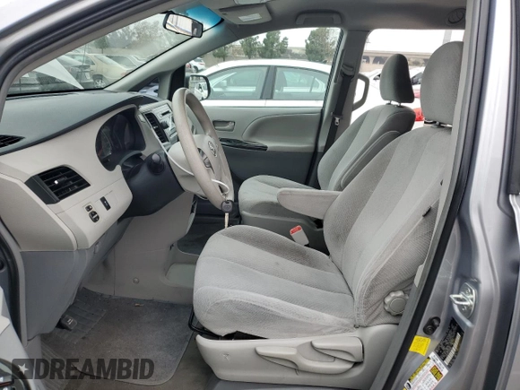 2012 Toyota Sienna with VIN 5TDKA3DC4CS014867, listed as a Copart auction lot 43191655 with 169,517 mi miles and Salvage Title. Bid and sale history available at DreamBid. Image 7.
