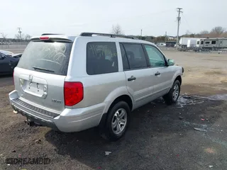 2005 Honda Pilot EX-L with NAVI with VIN 2HKYF18725H534538, listed as a IAAI auction lot 41677322 with 157,987 mi miles. Bid and sale history available at carsss.com. Image 4.