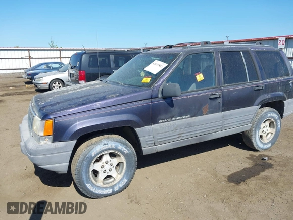 1997 Jeep Grand Cherokee Laredo z VIN 1J4GZ58Y2VC551199, wystawiony jako IAAI lot #42625502 z przebiegiem 210 722 mil mil oraz . Historia ofert i sprzedaży dostępna na DreamBid. Obrazek 2.