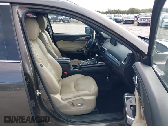 2017 Mazda CX-9 Grand Touring with VIN JM3TCADY7H0133092, listed as a IAAI auction lot 41133652 with 233,454 mi miles and . Bid and sale history available at DreamBid. Image 5.