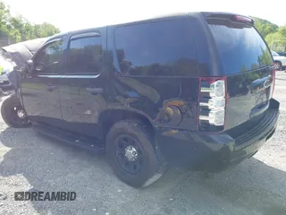 2013 Chevrolet Tahoe Commercial with VIN 1GNLC2E00DR265941, listed as a IAAI auction lot 42289977 with 206,840 mi miles and . Bid and sale history available at DreamBid. Image 3.