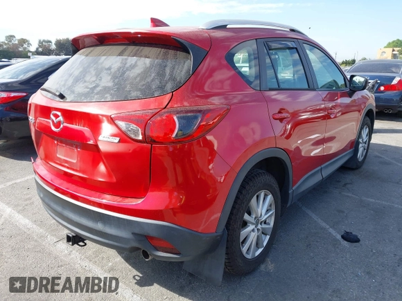 2016 Mazda CX-5 Sport with VIN JM3KE2BY4G0701442, listed as a IAAI auction lot 41682335 with 125,624 mi miles. Bid and sale history available at carsss.com. Image 4.
