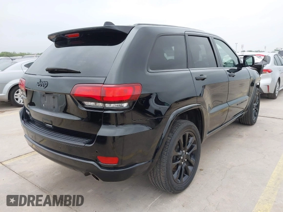 2021 Jeep Grand Cherokee Laredo X with VIN 1C4RJEAG8MC714539, listed as a IAAI auction lot 42190686 with 59,359 mi miles and . Bid and sale history available at DreamBid. Image 4.
