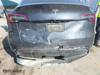 2021 Tesla Model Y Long Range with VIN 5YJYGDEE8MF278212, listed as a IAAI auction lot 41639320 with 53,707 mi miles. Bid and sale history available at carsss.com. Image 6.