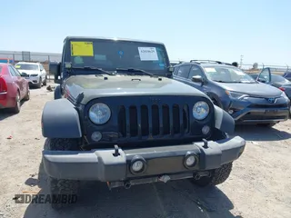 2015 Jeep Wrangler Sport with VIN 1C4AJWAGXFL650428, listed as a IAAI auction lot 42010629 with 80,039 mi miles. Bid and sale history available at carsss.com. Image 12.