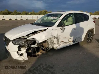 2016 Mazda CX-5 Grand Touring z VIN JM3KE2DYXG0802224, wystawiony jako Copart lot #82257514 z przebiegiem 92 617 mil mil oraz Szkoda całkowita • Salvage title. Historia ofert i sprzedaży dostępna na DreamBid. Obrazek 1.