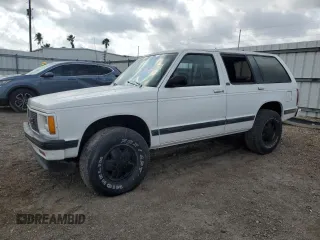 1994 GMC Jimmy Diamond Edition Luxury z VIN 1GKDT13W5R2503916, wystawiony jako Copart lot #54717215 z przebiegiem 99 991 mil mil oraz Szkody całkowita. Historia ofert i sprzedaży dostępna na DreamBid. Obrazek 1.