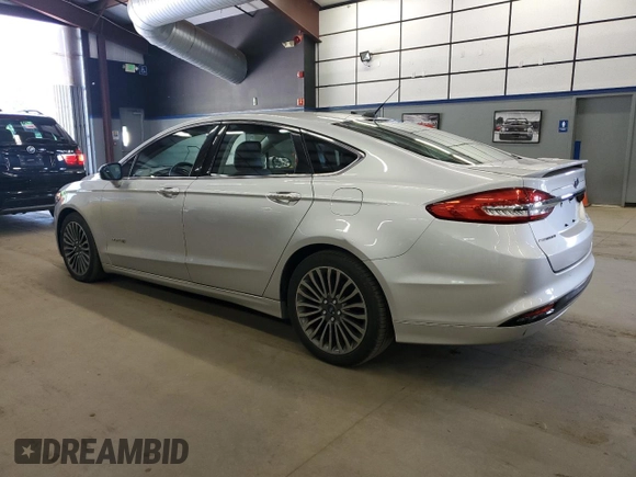 2017 Ford Fusion Hybrid Titanium z VIN 3FA6P0RU1HR300370, wystawiony jako Copart lot #65206605 z przebiegiem 150 424 mil mil oraz Czysty tytuł • Clean title. Historia ofert i sprzedaży dostępna na DreamBid. Obrazek 2.