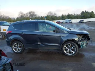 2015 Ford Escape Titanium with VIN 1FMCU0J92FUB74972, listed as a IAAI auction lot 41164519 with 228,785 mi miles and . Bid and sale history available at DreamBid. Image 13.