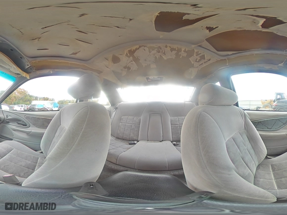 1996 Ford Thunderbird LX with VIN 1FALP62W7TH135632, listed as a Copart auction lot 77134024 with 128,931 mi miles and Salvage Title. Bid and sale history available at carsss.com. Image 13.