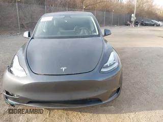 2023 Tesla Model Y Long Range with VIN 7SAYGAEEXPF612231, listed as a IAAI auction lot 41758243 with 32,924 mi miles and . Bid and sale history available at DreamBid. Image 13.