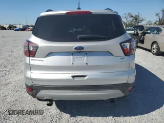 2018 Ford Escape SE with VIN 1FMCU0G98JUB49767, listed as a Copart auction lot 48140885 with 90,906 mi miles and Salvage Title. Bid and sale history available at carsss.com. Image 6.