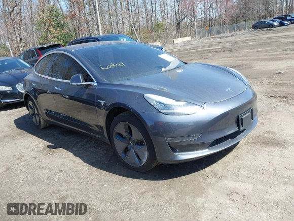 2018 Tesla Model 3 Long Range Battery z VIN 5YJ3E1EB1JF093175, wystawiony jako IAAI lot #41766128 z przebiegiem Nie podano mil oraz . Historia ofert i sprzedaży dostępna na DreamBid. Obrazek 1.
