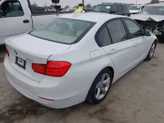 2014 BMW 3 Series 320i with VIN WBA3B1G58ENS80160, listed as a IAAI auction lot 42029951 with 97,306 mi miles. Bid and sale history available at carsss.com. Image 4.