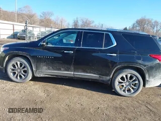 2018 Chevrolet Traverse Premier z VIN 1GNEVJKW5JJ174261, wystawiony jako IAAI lot #41656906 z przebiegiem 101 908 mil mil oraz . Historia ofert i sprzedaży dostępna na DreamBid. Obrazek 14.